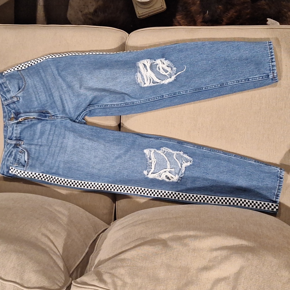 A EMPYRE Eileen Mom Jeans with checker print on the side.
